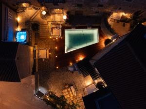 an overhead view of a swimming pool at night at Istrian Perfect Life in Šmarje