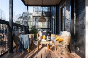 a patio with chairs and a table on a balcony at Pargi 21 Apartments in Tartu