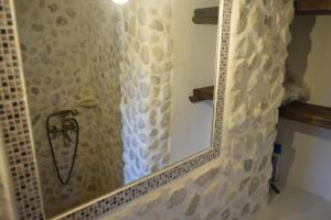 a bathroom with a shower with a mirror at Villa Araklis, Ithaca in Anoyí +12 photos