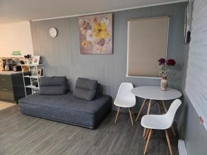 a living room with a couch and a table at Brossard home in Brossard