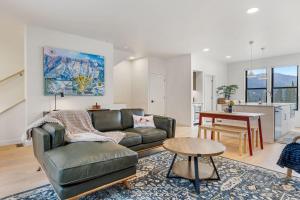 a living room with a couch and a table at Bridger Bowl - Crosscut Hideaway in Bozeman