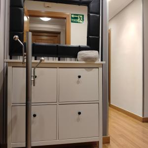 a bathroom with a vanity with a mirror at Las heras apartamento in Medrano +4 photos