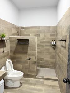 a bathroom with a toilet and a shower at los agaves lto in Loreto