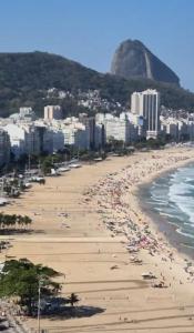 a beach with a lot of people on it at VILA LEME Casa 11A in Rio de Janeiro