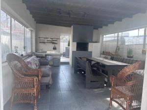 a kitchen with a table and chairs and a couch at SeaLine Odessa in Kryzhanivka