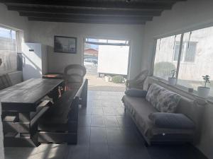 a living room with a couch and a table at SeaLine Odessa in Kryzhanivka