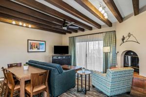 a living room with a couch and a table at Starr Pass Golf Suites in Tucson