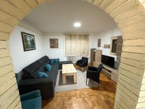 a living room with a couch and a table at Villa Igman in Hrasnica