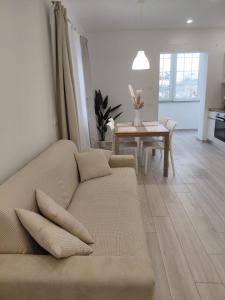 a living room with a couch and a table at b&b Il Margonico in Potenza