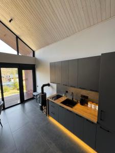 a kitchen with a sink and a counter top at Stodola Slavsko котедж з чаном-джакузі in Slavske