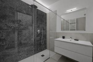 a bathroom with a shower and a sink and a mirror at La Casetta in Toscolano Maderno +18 photos