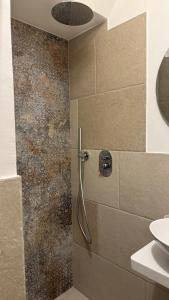a shower in a bathroom with a sink at Samy Suite in Fasano +35 photos