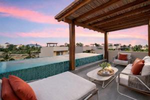 an outdoor patio with a swimming pool on a house at Casita VR09 in Zihuatanejo