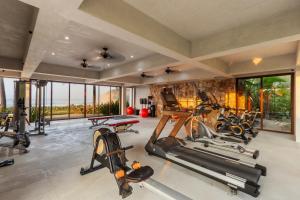 a gym with several exercise equipment in a room at Casita VR09 in Zihuatanejo