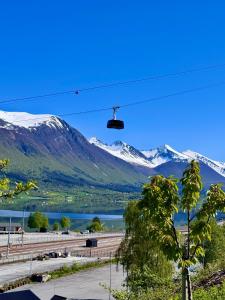 a view of a mountain range with a ski lift at Trollveggen in Åndalsnes