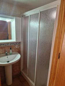 a bathroom with a shower and a sink at Casa Dulcinea in Alborea +19 photos