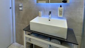 a bathroom with a white sink in a room at Vesta Motel in Vieste +19 photos