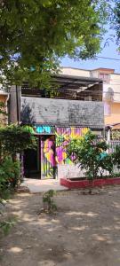 a building with a painting on the side of it at Backpackers House - Near The Airport in Santiago