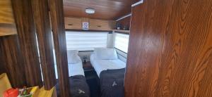a small room with a bed and a couch at Camper Elegance Uyuni - All Inclusive in Carpas