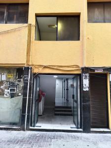 an entrance to a building with an open door at United Holiday Homes in Dubai +3 photos