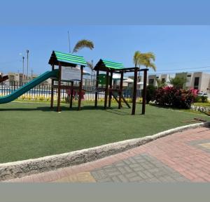 a playground with a slide in a park at Newly Opened Mini Suite in Manta