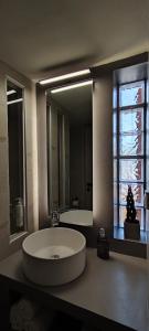 a large bathroom with a large sink and a large mirror at Niki`s Luxury Apartment in Makry Gialos +28 photos