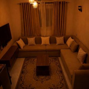 a living room with a couch and a table at Zaytun Hotel Dahab in Dahab +14 photos