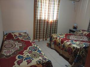a bedroom with two beds and a window at Celina in Chajarí