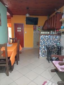 a dining room with a table and a tv at Celina in Chajarí