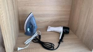 a iron and a hair dryer sitting on a table at Aerobeach Apartments in Cartagena de Indias