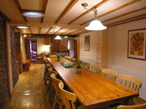 a dining room with a wooden table and chairs at Stables- Ukc4912 in Timberscombe