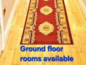 a rug on a floor with the words ground floor rooms available at Rockfield Manor B&B, Knock in Knock +78 photos