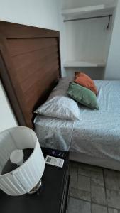 a bedroom with a bed with a headboard and a scale at El Cedralito in Mérida
