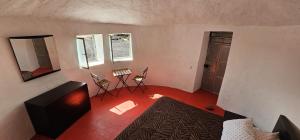 an overhead view of a living room with a red floor at Funco Jacó in Portela +26 photos