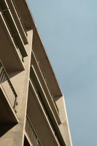 a tall building with the sky in the background at Casa Cibeles by Lumina in Mexico City