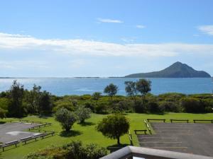 a park with a view of the water and a mountain at Shoal Bay Water Views, 1 night stays available in Nelson Bay