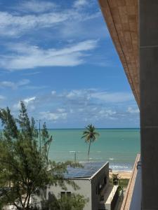 a view of the beach from the balcony of a house at Garden Haus - Flat beira mar in João Pessoa