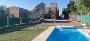 a swimming pool in a yard next to a fence at DEPARTAMENTO CAROLA in San Juan