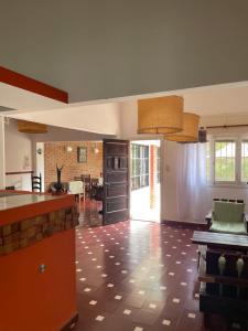 a large kitchen with a dining room and a living room at CASONA Malva del Rio in Villa Carlos Paz