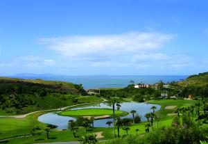 a view of a golf course with a lake at Milan San Marino in Tijuana