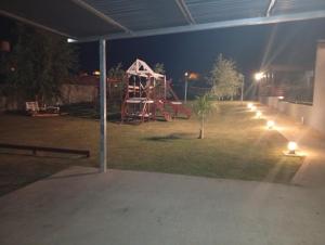 a park with a playground at night with lights at Complejo Aura in Colón