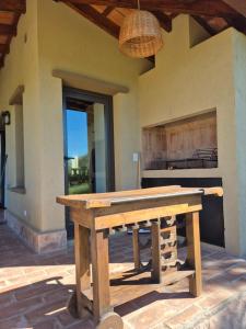 a wooden picnic table in front of a house at Casa Nido San Javier in San Javier