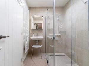 a bathroom with a glass shower and a sink at Aperol Spritz in Zutendaal +43 photos