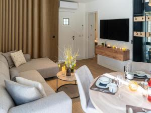 a living room with a couch and a table at Aperol Spritz in Zutendaal