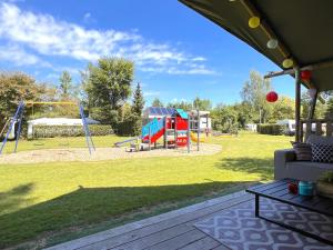 a park with a playground with a swing at De Mier in Hulshorst