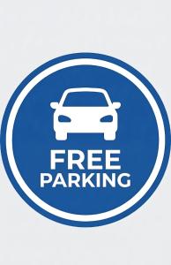 a blue free parking sign with a white car at DELUXE APARTMENTS - parking , central suites in Drama