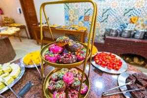 a display of donuts with sprinkles on a table at China Park Eco Resort in Domingos Martins