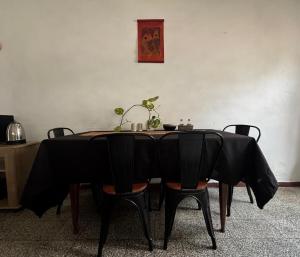 a table with chairs and a black table cloth at Habitacion Privada, Single Room in Paysandú