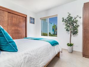 a bedroom with a large bed and a window at Ocean View, Amazing Sunsets, AC, Pool in Tijuana +25 photos
