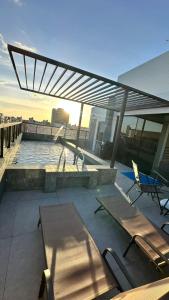 a swimming pool on top of a building at Flat com acesso rápido as praias e o melhor do turismo local in João Pessoa